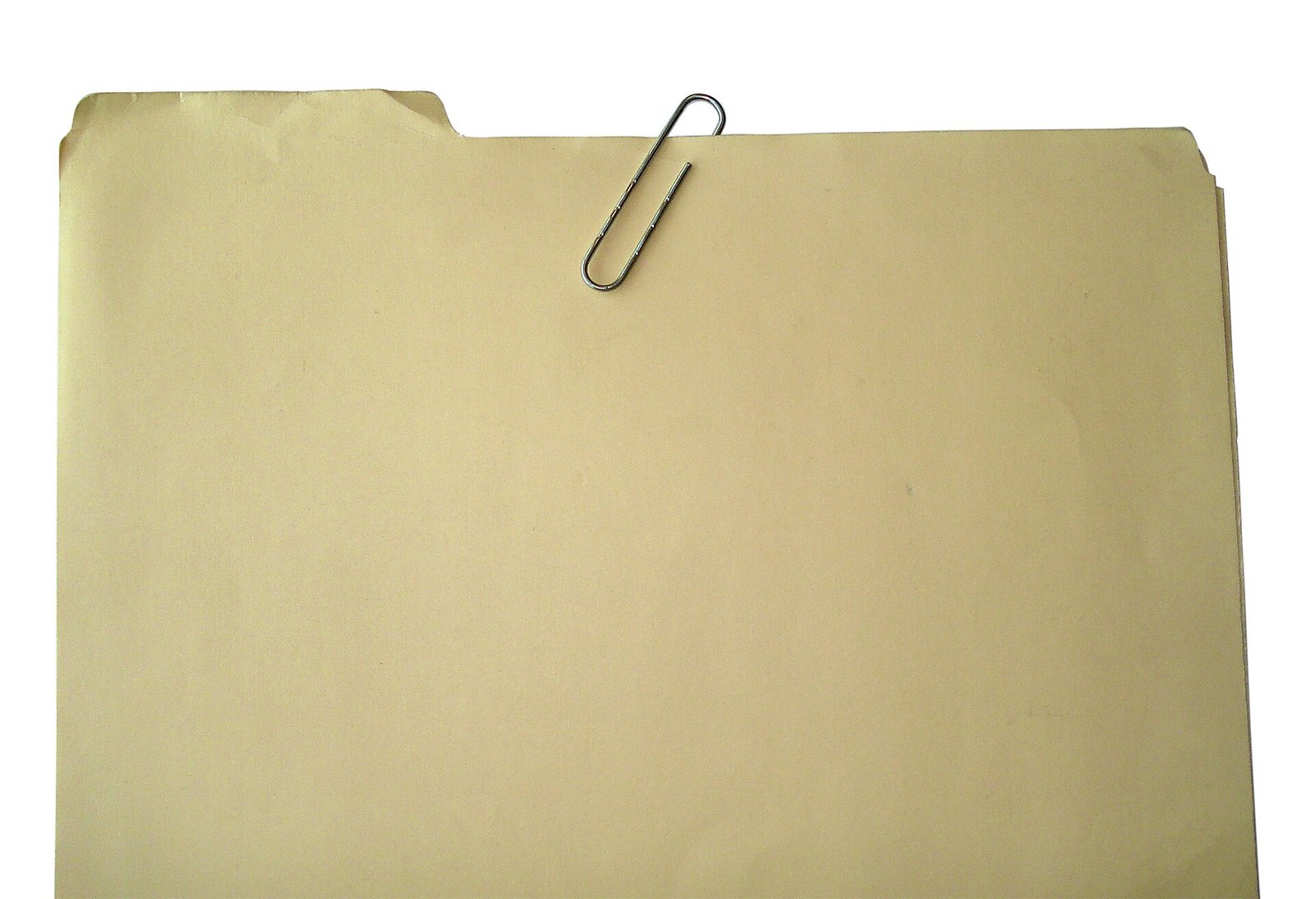 A manila folder held closed by a paperclip